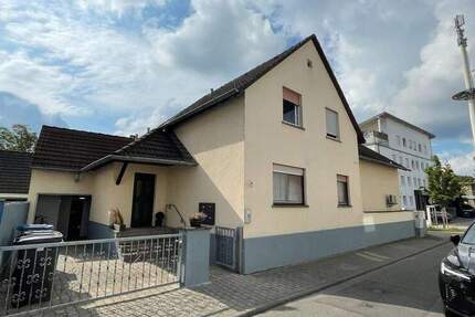 Wohn- und Geschäftshaus in Langen 9 zimmer